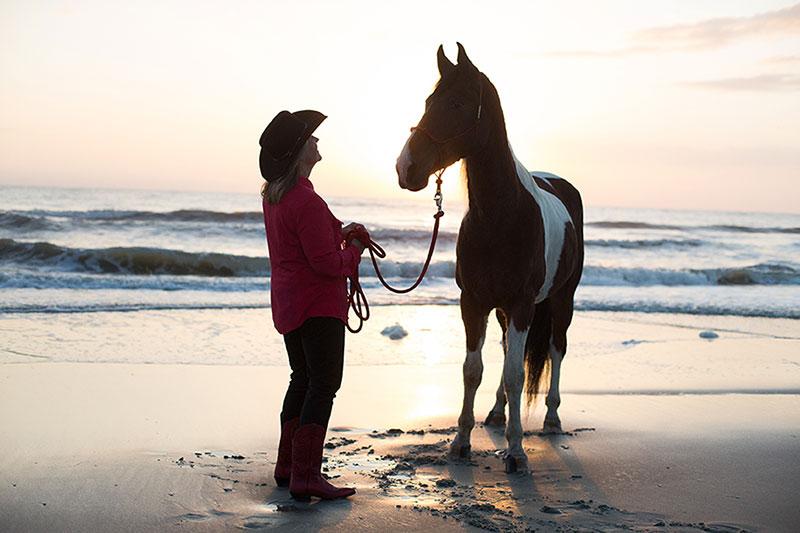 Debby and her horse at sunset - beach ride