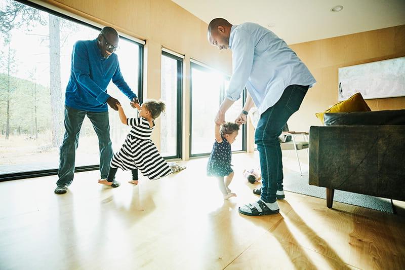 Gr和father father dancing with daughters at home