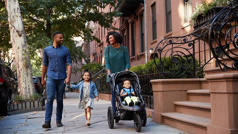 happy family walking in urban outdoors