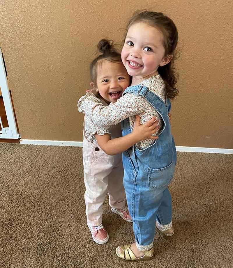 Ariel Hernandez (right) hugs her twin sister, Katalina. (Photo courtesy of Kristal Hernandez)